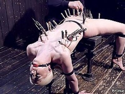 Blonde in device bondage ass hooked