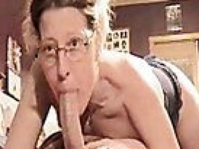 Woman in glasses deepthroats long cock