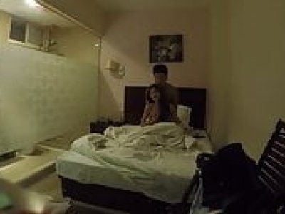 Teen couple has fun in a hotel room