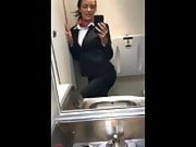 Naughty busty stewardess playing with her pussy in restroom