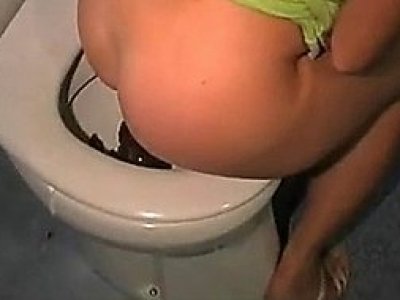 Girl pooping on the toilet
