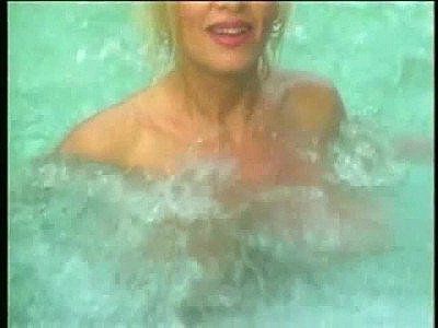 Huge tits girl splashing in the hot tub slow motion